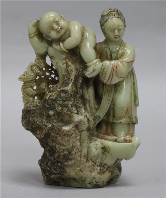 A Chinese export polychrome soapstone group of a mother and child, probably 18th century, height 11.5cm